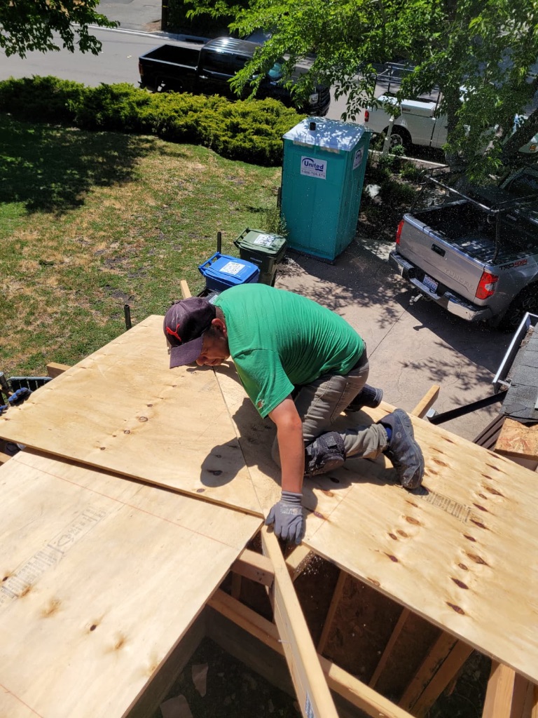 Roof sheathing crew working