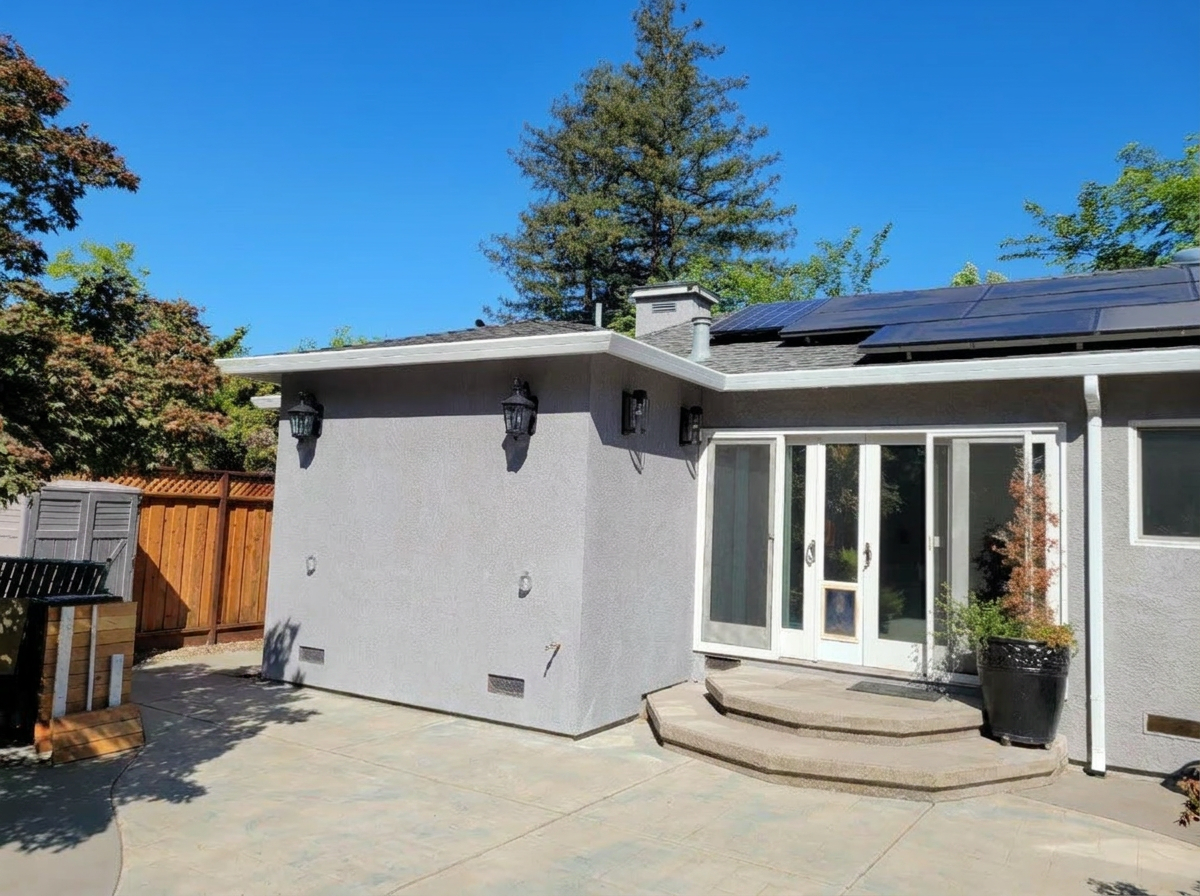Room addition exterior with stucco
